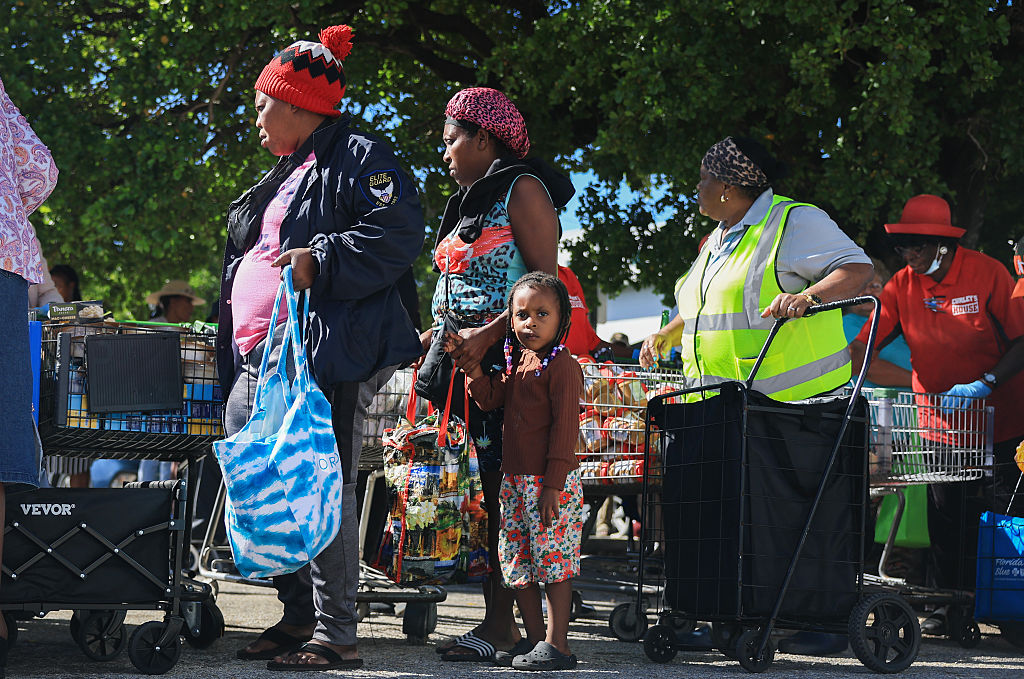A Florida food bank organizes a food distribution event just before federal food aid funds are depleted because of a government shutdown