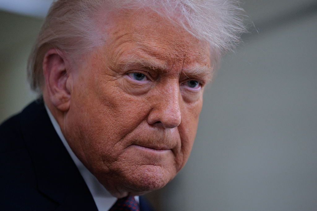 U.S. President Donald Trump speaks to reporters on board Air Force One while flying in between Ireland and Washington as he returns from the World Economic Forum on Jan. 22, 2026.